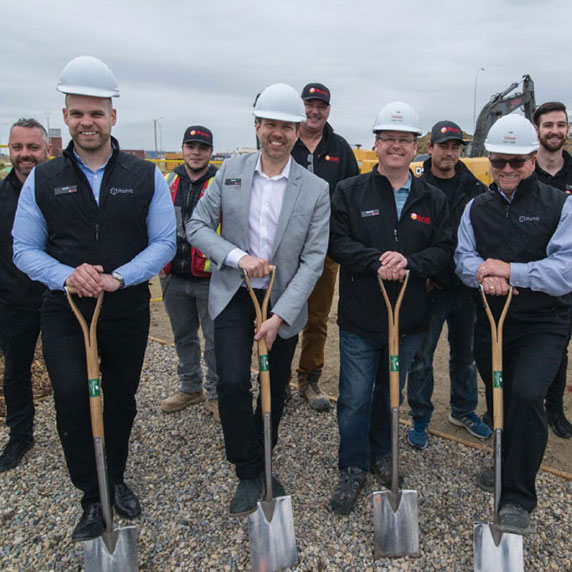 Rohitians with shovels breaking ground.