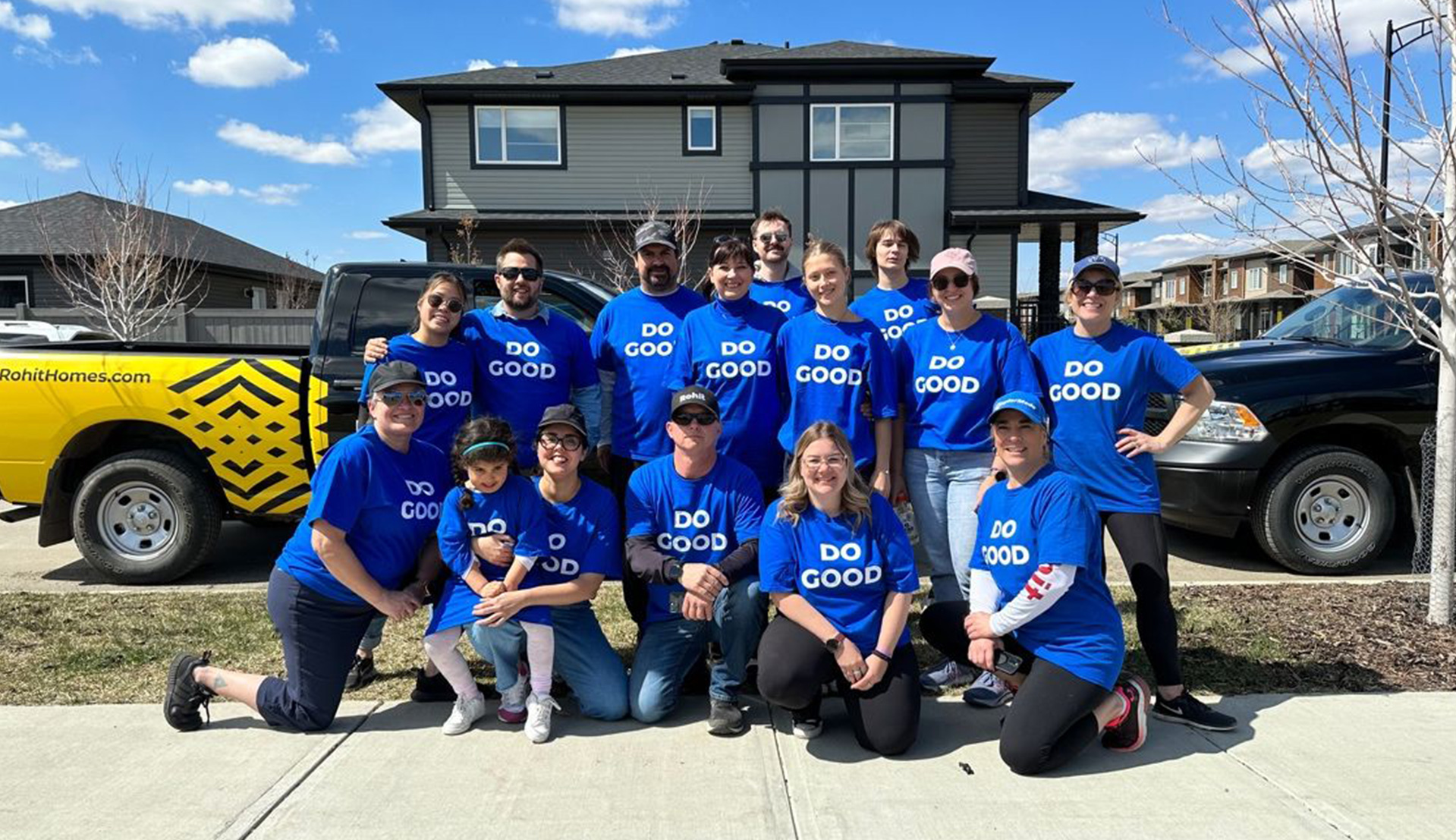 Team of Do Gooders standing and sitting for photo.