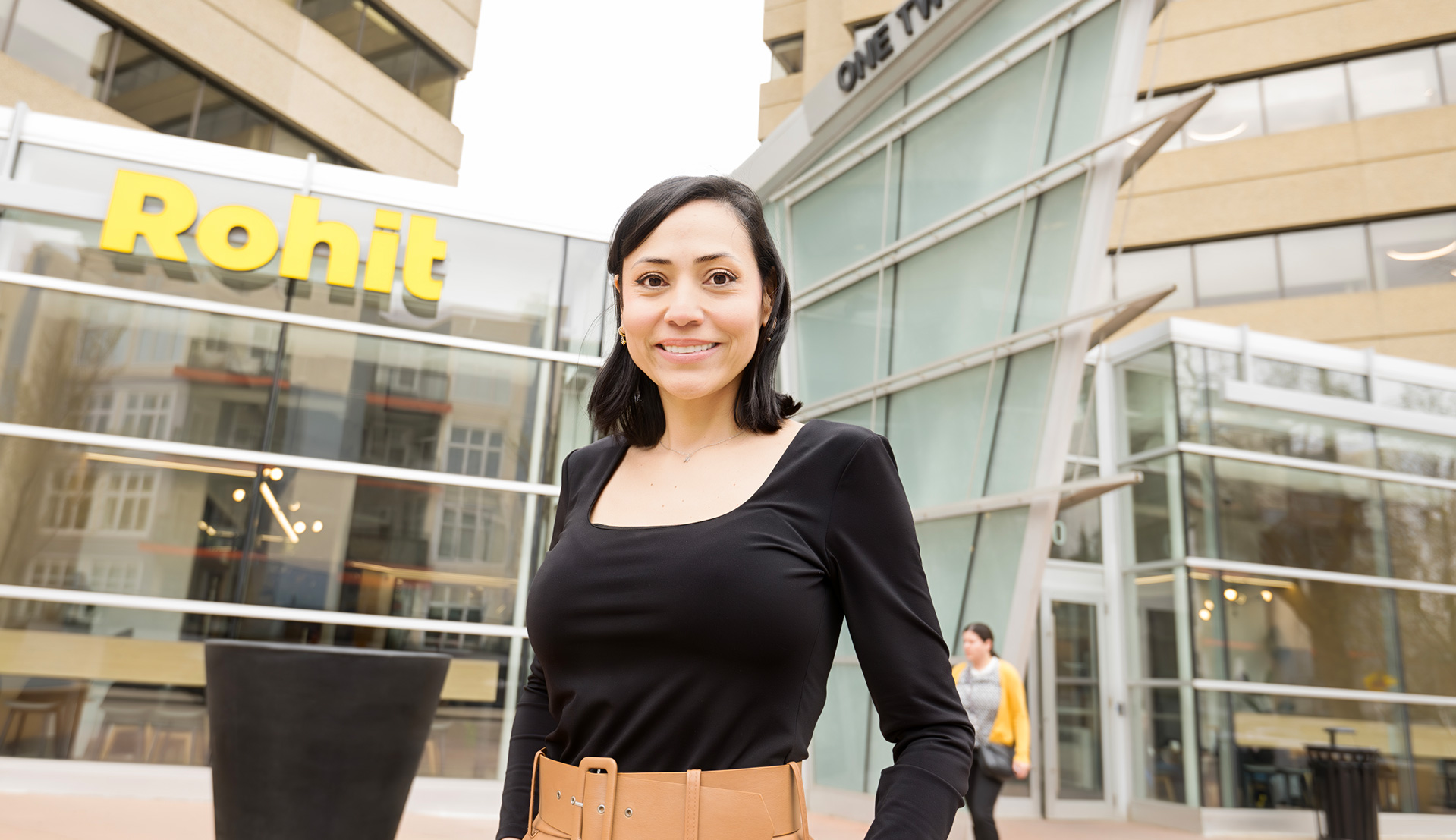 Woman standing in front of Rohit One Twelve Campus building.