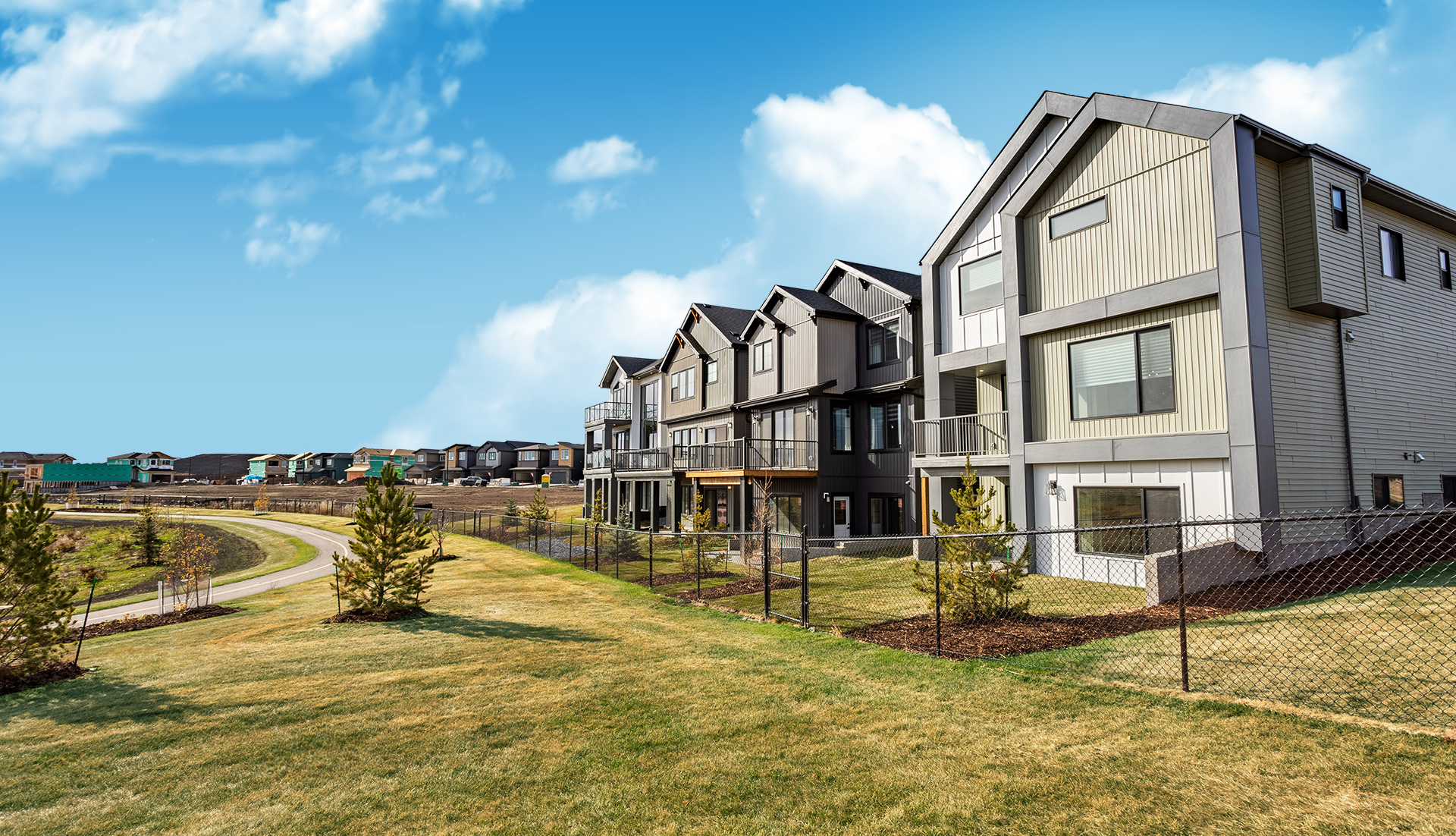 Community photo of houses and houses in background being built.