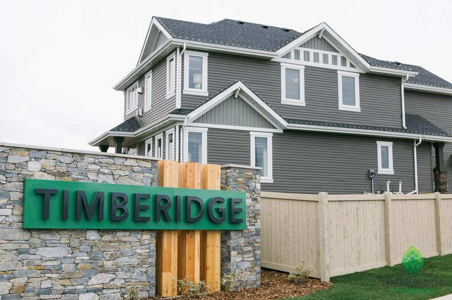 Photo of Timberidge community and house in background.